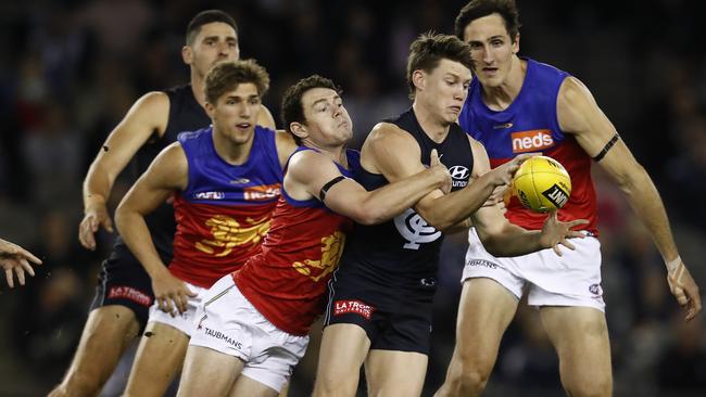 Lachie Neale battled on to help Brisbane Lions defeat Carlton.