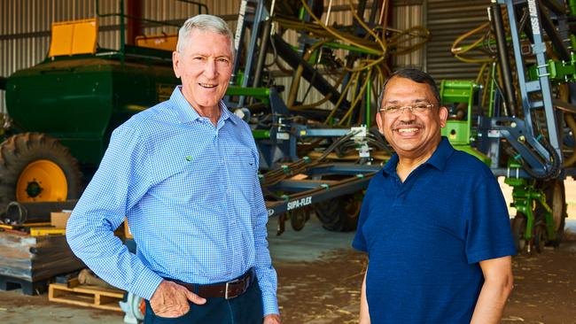 Olam Australia chief Bob Dall’Alba with Sunny Verghese in the vast machinery shed at Lynora Downs. Picture: John Elliott