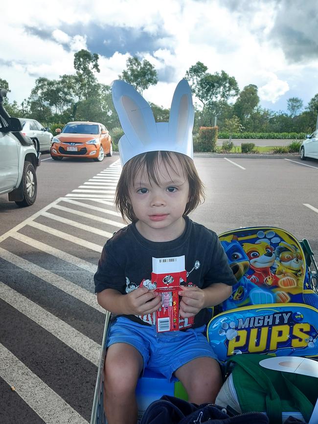 Jonas Harvey was having lollies on the trolley after the Easter shopping back on March. Picture: Ash Chau