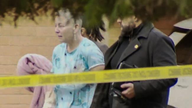 Ms Hopkinson being escorted from her home in her pyjamas on Sunday morning. Picture: 9News Adelaide