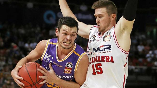 Jason Cadee of the Kings evades Rotnei Clarke of the Hawks. Picture: DANIEL MUNOZ