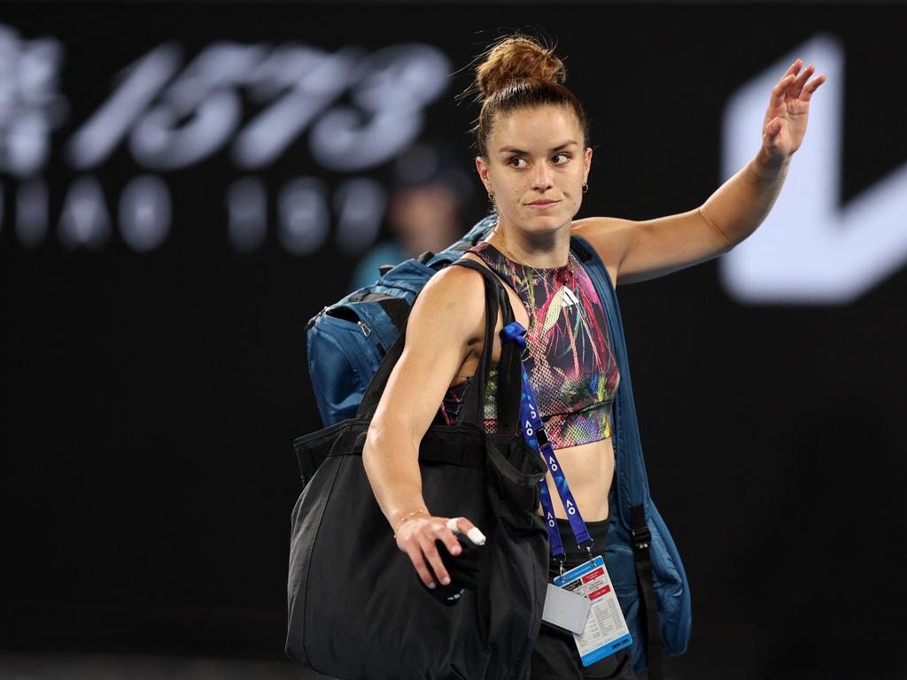 Greece's Maria Sakkari waves as she leaves the court after losing to China's Zhu Lin. Picture: Martin Keep/AFP