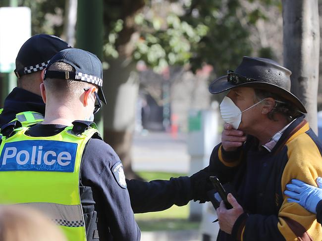 Victoria Police are on red alert ahead of plans by coronavirus deniers to stage a public demonstration at the Shrine of Remembrance in Melbourne, as the number of cases of the highly infectious disease soars. This man appeared to receive a ticket. Picture: Alex Coppel.