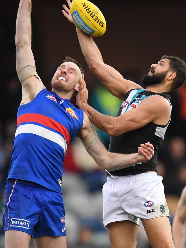 Bulldogs tall Jordan Roughead rucks against and Patrick Ryder who defied a hip injury to return for the crucial clash. Picture: AAP Image/Julian Smith