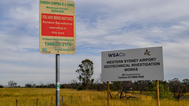 Signs warn trespassers and rubbish dumpers at the Badgerys Creek airport site yesterday.