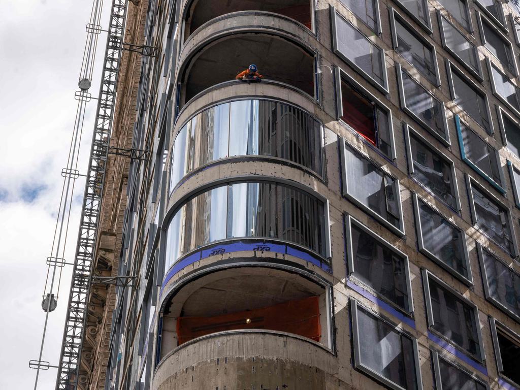 A worker peers out from a worksite in lower Manhattan moments after New York City and parts of New Jersey experienced a 4.8 magnitude earthquake. Picture: Getty Images via AFP