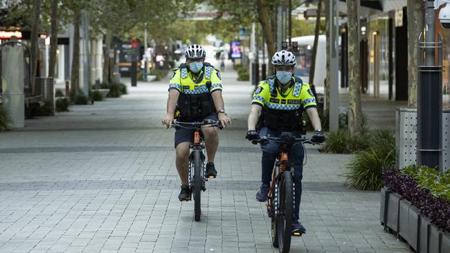 Police patrol the CDB an hour into the lockdown. Picture: Matt Jelonek/Getty Images.