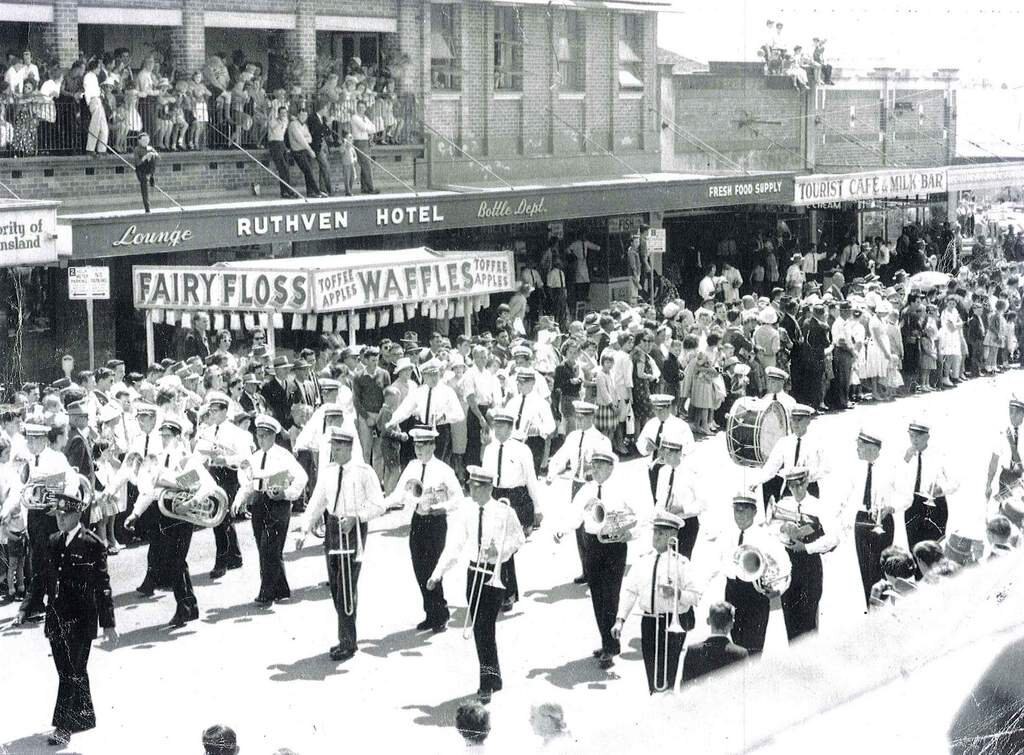 Brass band.jpg: A unique blend of history and close family connections feature with the Toowoomba citizens brass band pictured during the 1962 Carnival of Flowers parade. Band members include Les Kemp and twin sons Edgar and David, twins Ron and Ray Bonell and brother Trevor, Hec Muller and son Graham, Eric Sweeney and son-in-law Kev Bryant, brothers-in-law Jack Bestman and Ron McKenzie, included also are Ian Corkill, Gordon Flemming, Brian Cuskelly, Laurie Tanner, Harry Tawns, Alan Tedford, Cec Parker, Ron Hill, Gary Laurie, Gary Wiseman, Ray Cunningham (bass drum) and Noel Winter (drum major). Ken Bryant 46351033.