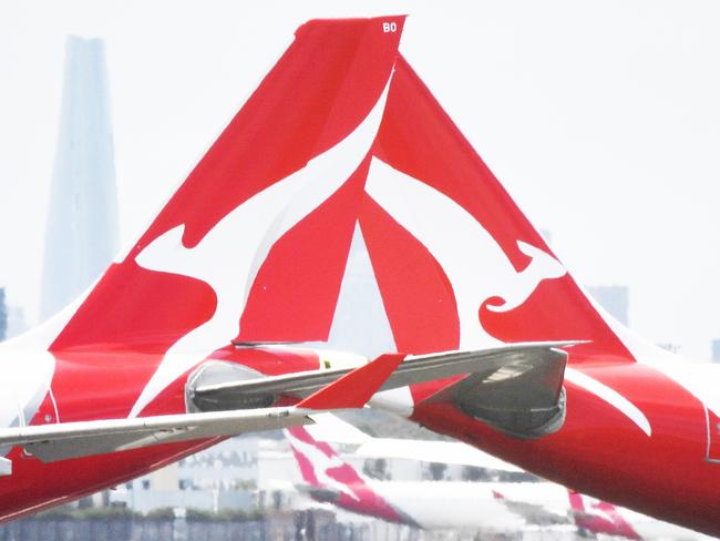 Qantas aircraft are seen at Sydney Airport, Thursday, 24 December 2020. Authorities are urgently investigating how a Qantas crew member contracted Covid-19 after arriving in Darwin from Paris and then flying to Sydney without being tested or quarantined. Federal health authorities are working with Qantas to understand how the man, who landed in Darwin on 17 December after working on a repatriation flight from Paris, became infected. Picture - Sam Mooy/The Australian Newspaperescape january 17 2021doc holiday