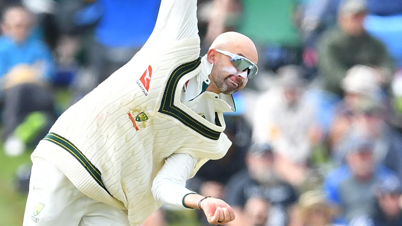 Australia's Nathan Lyon bowls wearing the knitted vest supplied by Silver Fleece. Picture: Sanka Vidanagama/AFP