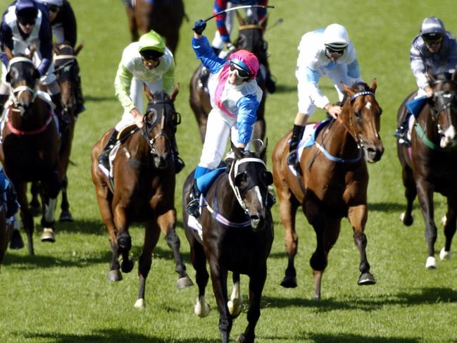 SA jockey Clare Lindop raises the whip after winning the 2006 Adelaide Cup in record time aboard Exalted Time.