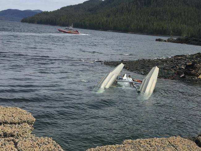 US Coast Guard crews respond to a mid-air collision between two seaplanes in Alaska. An Australian cruise ship passenger has died and 10 Americans are injured. Picture: AAP