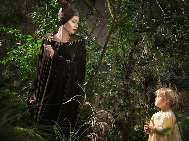 Family affair ... Angelina Jolie as Maleficent, left, in a scene with her daughter Vivienne Jolie-Pitt, portraying Young Aurora, in a scene from Maleficent.