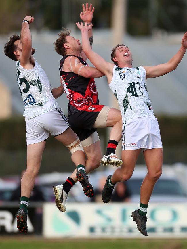 Kyabram’s Kayne Pettifer, centre, playing against Echuca this season. Picture: Yuri Kouzmin