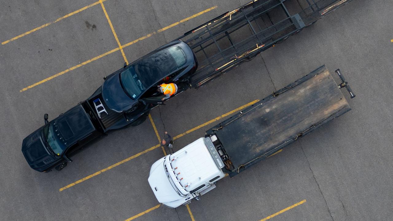 <!DOCTYPE html PUBLIC "-//W3C//DTD HTML 4.0 Transitional//EN" "http://www.w3.org/TR/REC-html40/loose.dtd"><html><body><p>An aerial view shows a damaged Tesla vehicle being towed from a dealership in Hamilton, Canada on March 20, 2025. Picture: HAMILTON, CANADA - MARCH 20: An aerial view of a damaged Tesla vehicle being carted off by workers at a dealership on March 20, 2025 in Hamilton, Canada. 80 Teslas were damaged at the Hamilton dealership, making it the largest car vandalism reported in Canada against the U.S. company. Katherine KY Cheng/Getty Images/AFP (Photo by Katherine KY Cheng / GETTY IMAGES NORTH AMERICA / Getty Images via AFP)</p></body></html>