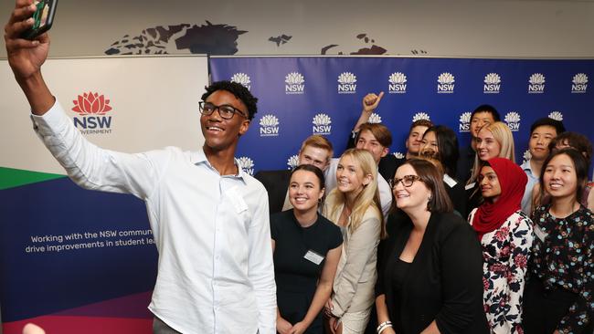 Andrew Malcolm takes a selfie with fellow HSC score toppers and the NSW Education Minister Sarah Mitchell at a special event celebrating the 2020 HSC First in Course recipients in Sydney. Picture: Richard Dobson