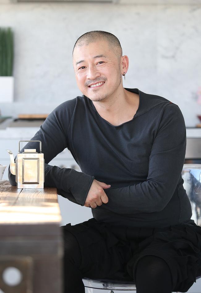 Edward Li with a teapot that was handed down from his parents.