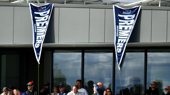 Diggers Rest unfurls its senior and reserve grade premiership flags. Picture: Josh Chadwick