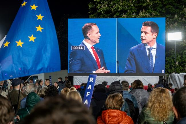 Pro-EU Warsaw Mayor Rafal Trzaskowski (R) is set to face nationalist historian Karol Nawrocki in Poland's presidential runoff