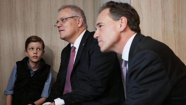 Ally Clarke, 10, with federal Treasurer Scott Morrison and Health Minister Greg Hunt at Frankston Hospital. Picture: Stefan Postles