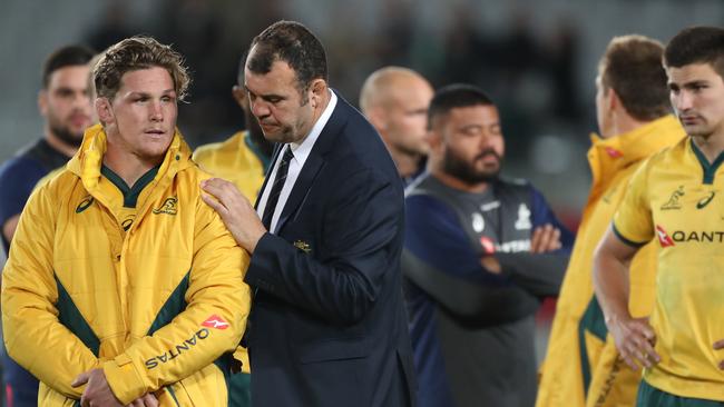 Michael Cheika comforts Wallabies skipper Michael Hooper. Picture: AAP