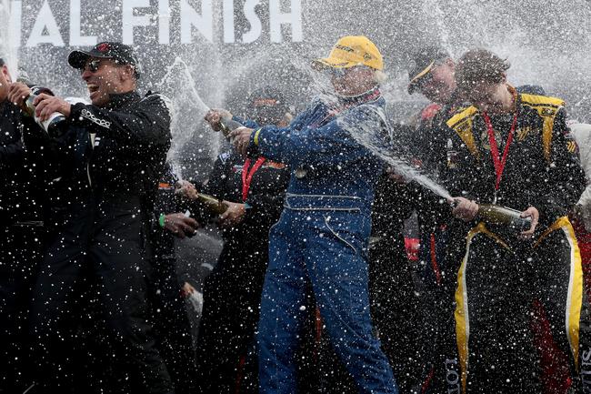 Champagne spray by the winners. Finish of Targa Tasmania 2019 at Macquarie Wharf shed no. 2. Picture: NIKKI DAVIS-JONES