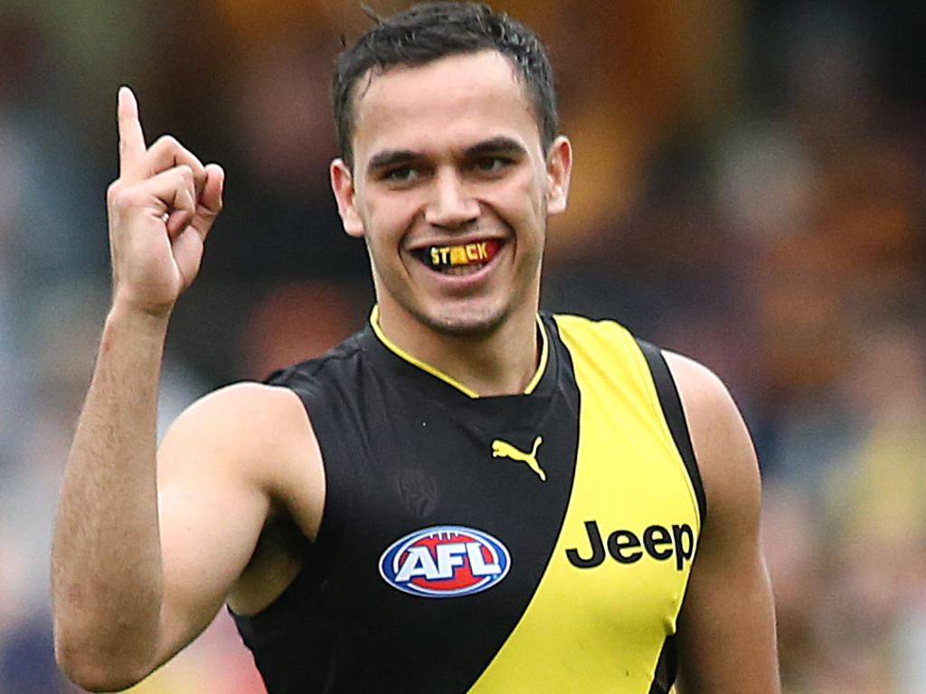 GOLD COAST, AUSTRALIA - JULY 06: Sydney Stack of the Tigers celebrates a goal during the round 16 AFL match between the Gold Coast Suns and the Richmond Tigers at Metricon Stadium on July 06, 2019 in Gold Coast, Australia. (Photo by Jono Searle/AFL Photos via Getty Images )