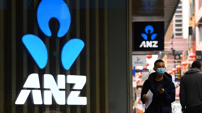 A man walks past an ANZ bank sign in Melbourne's Chinatown on April 30, 2020. Picture: AFP