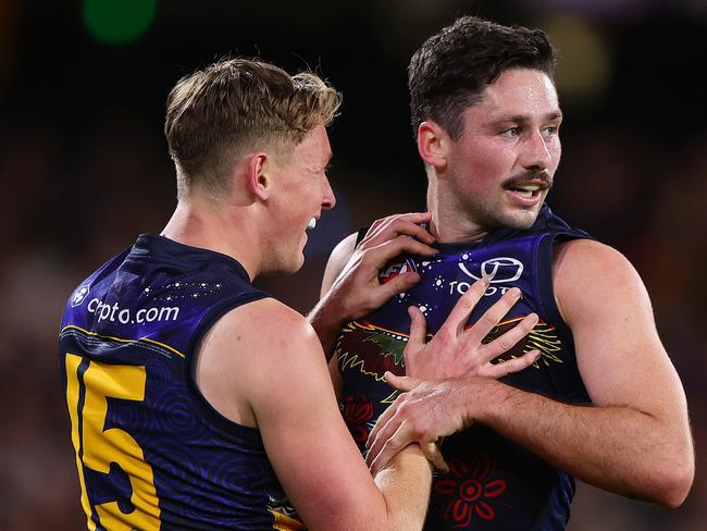 ADELAIDE, AUSTRALIA - MAY 26: Chayce Jones of the Crows celebrates a goal with Brayden Cook during the 2024 AFL Round 11 match between Kuwarna (Adelaide Crows) and Waalitj Marawar (West Coast Eagles) at Adelaide Oval on May 26, 2024 in Adelaide, Australia. (Photo by Sarah Reed/AFL Photos via Getty Images)