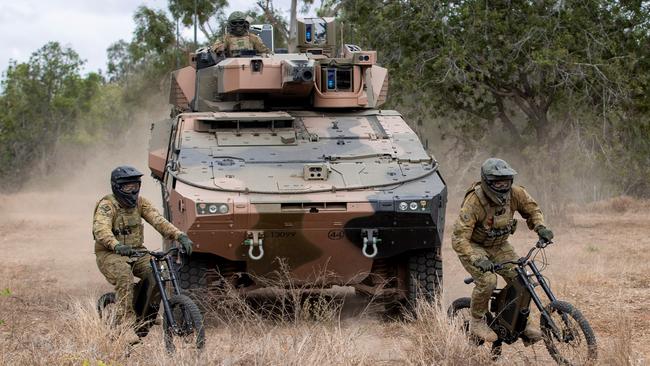 The ADF is trialling Stealth Reconnaissance E-Bikes in conjunction with the new Boxer Combat Reconnaissance Vehicle in north Queensland Picture: CPL Nicole Dorrett