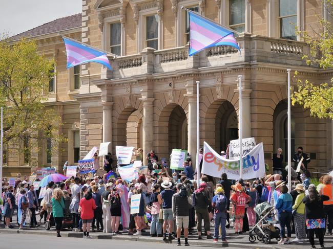 Pro-transgender activists clash with anti-transgender feminists outside Hobart Town Hall. Picture: Kenji Sato