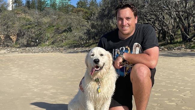 Mountain Creek resident Nick Green and his golden retriever Happy at Point Cartwright.