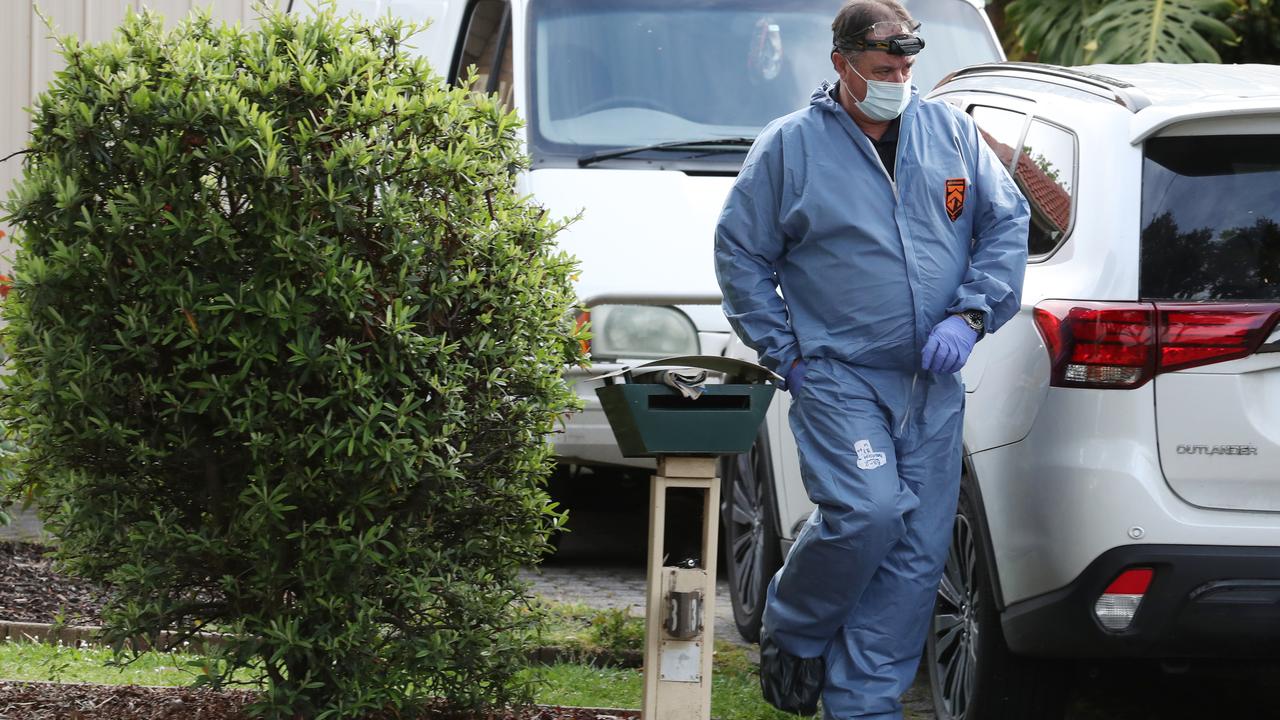 Police and forensics at the scene in Bayswater North where Michelle Darragh was found lifeless next to her injured ex-partner, Ben Coman. Picture: David Crosling