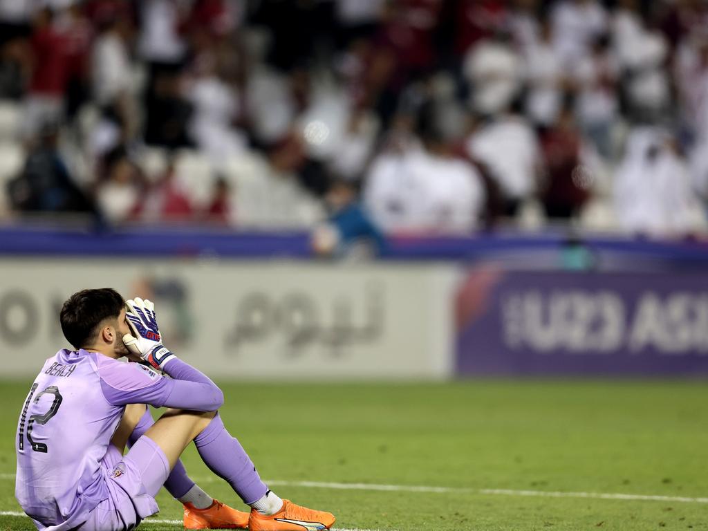 Dejected Olyroos goalkeeper Patrick Beach reflects on his side’s failure to qualify for the Paris Olympics. Picture: Mohamed Farag/Getty Images