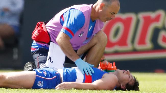 Liam Picken lies on the field injured after a collision with a teammate. Picture: Getty