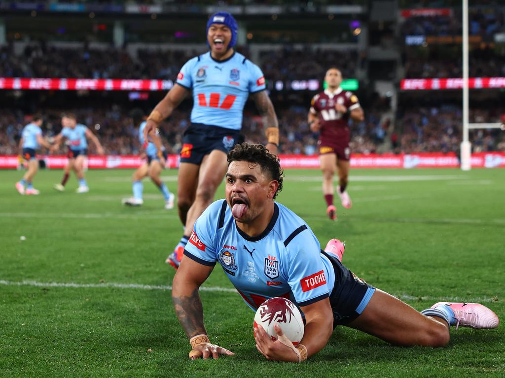 NSW player Latrell Mitchell celebrated a thrilling try during Game 2 of the men’s State of Origin series at the Melbourne Cricket Ground. The powerhouse performance helped propel New South Wales towards a dramatic victory over Queensland, igniting the crowd at one of rugby league’s most anticipated matchups. Picture: Getty