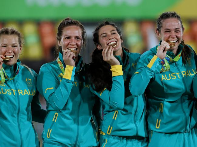 The Australian team celebrate winning the 2016 Rio Olympic Women's Rugby Sevens gold medal game over New Zealand at Deodoro Stadium, Rio. Pics Adam Head