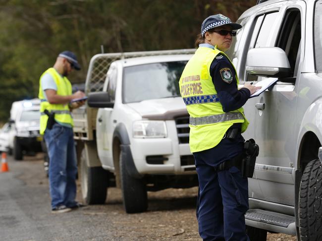 Police interview drivers near Benaroon Drive. Picture: David Moir