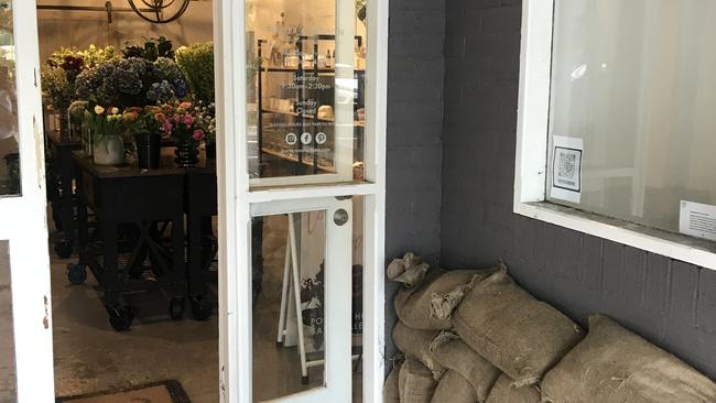 Porter and Hudson flower shop is open for business after a creek threatened to flood the main street of Picton on March 2. Picture: Adelaide Lang