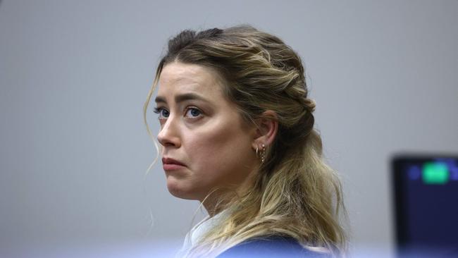 Amber Heard listens to Johnny Depp’s testimony. Picture: AFP