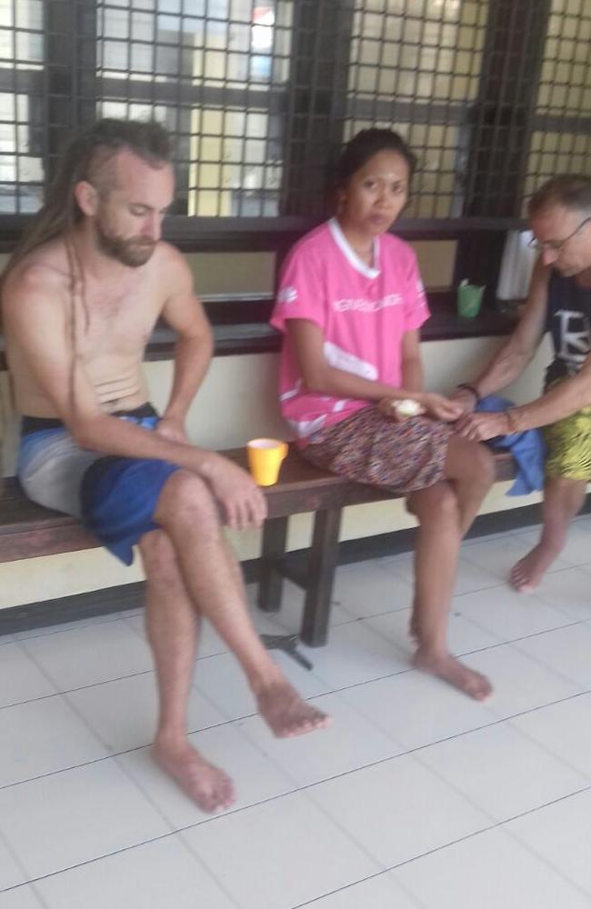 Bali murder suspect David Taylor cuts a forlorn figure with other prisoners  at the Denpasar police station in Bali. Picture: Lukman S. Bintoro