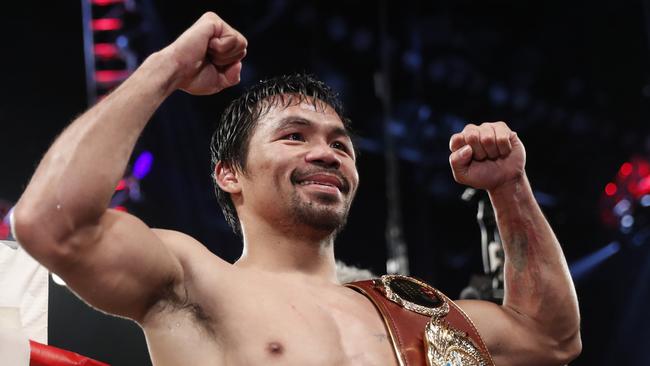 Manny Pacquiao celebrates his win over Jessie Vargas.