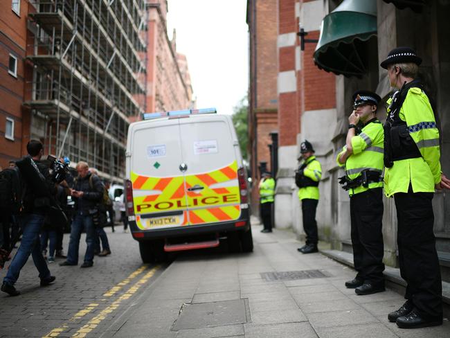 Police guard the entrance to Granby House in the Manchester city centre after an armed raid. Picture: Jeff J Mitchell/Getty Images