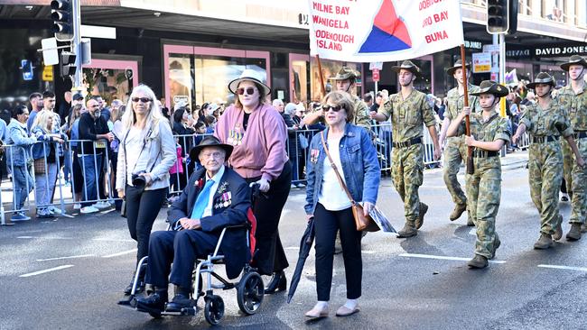 Hand held Australian flags held by onlookers fluttered for the full length of the march parade. Picture: NCA NewsWire / Jeremy Piper