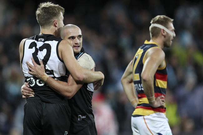 Power’s Dougal Howard hugs Sam Powell-Pepper after he slotted a goal against the Adelaide Crows in Showdown 46 at Adelaide Oval. , Picture Sarah Reed