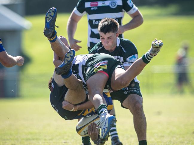 19/04/25. News Local. Sport. Warriewood, Sydney, NSW.Pics by Julian Andrews.Action pictures from the 1st Colts match between Warringah vs Sydney Uni at Pittwater Rugby Park, Warriewood.Pic shows:Warringah player: Sydney Uni player: Dane Mitchell gets upended