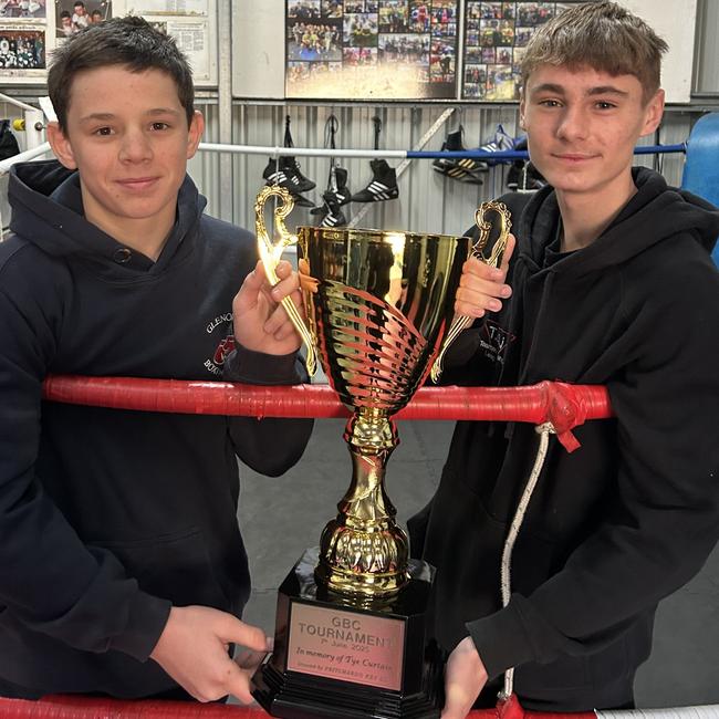 Teenage boxers Tyler Wordsworth (Glenorchy) and Jett Ford (Brighton) with the Tye Curtain Memorial Trophy they will fight for at KGV on Saturday night. Picture Supplied