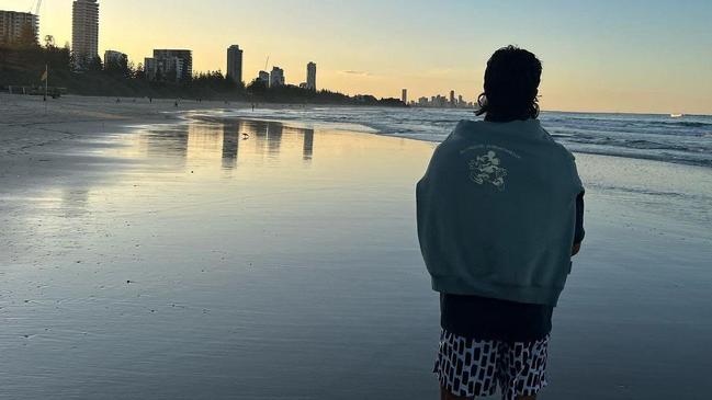 Daicos enjoying a relaxing walk on a Gold Coast beach.