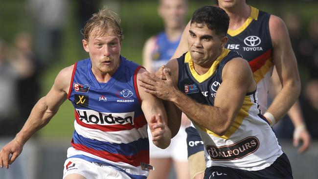 Adelaide’s Tyson Stengle puts pressure on Central’s Travis Schiller in the SANFL. Picture: AAP Image/Dean Martin