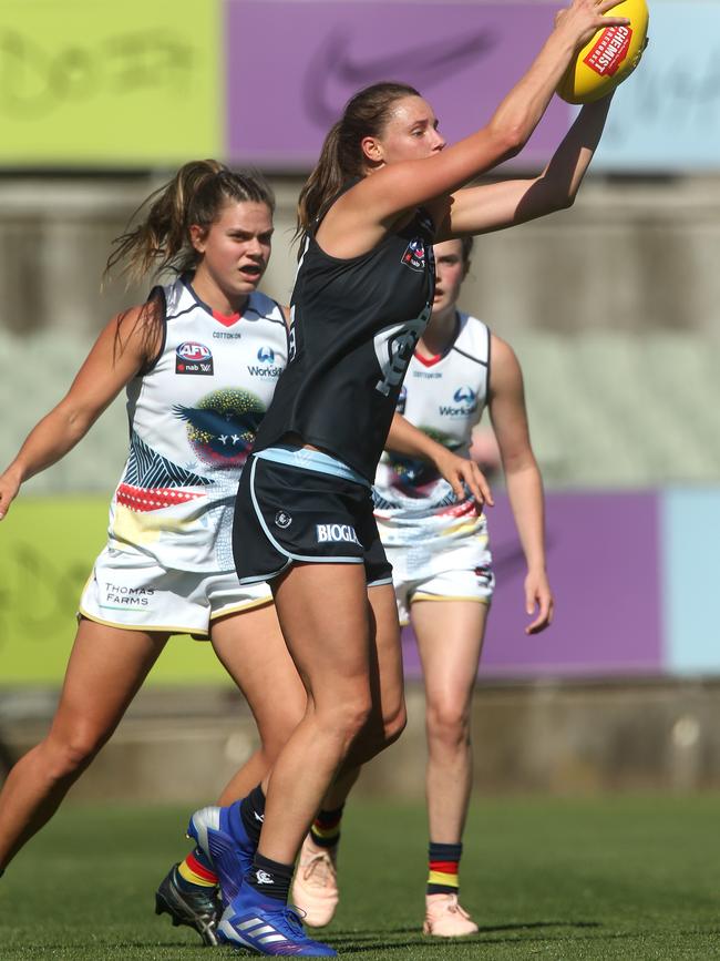 Carlton’s Rhiannon Watt marks in front of Adelaide’s Anne Hatchard during the Round 2 AFLW match at Ikon Park. Picture: Hamish Blair/AAP